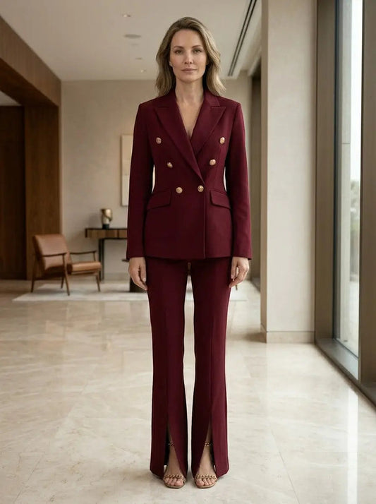Women's elegant white suit featuring a tailored double-breasted blazer and flared trousers, perfect for sophisticated office wear.