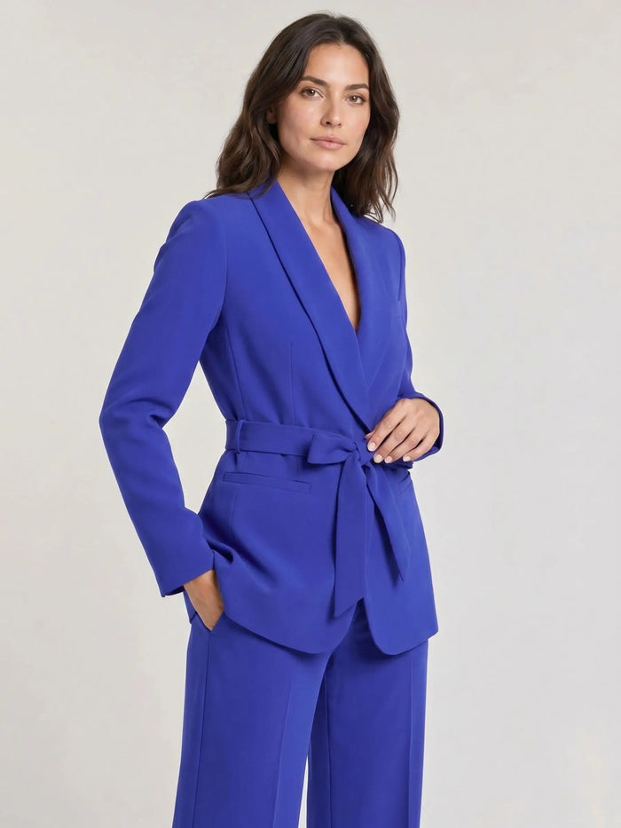 Women's tailored blazer and wide-leg trousers set in lightweight fabric, perfect for spring and summer fashion.