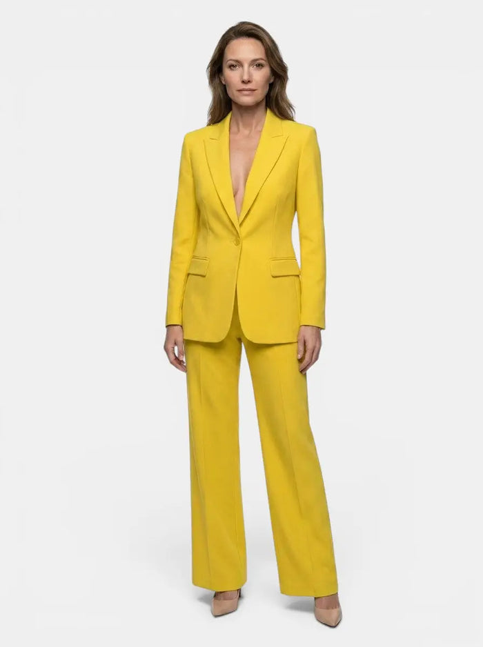 Women's elegant tailored blazer suit featuring a white longline blazer and wide-leg trousers, stylish and sophisticated.