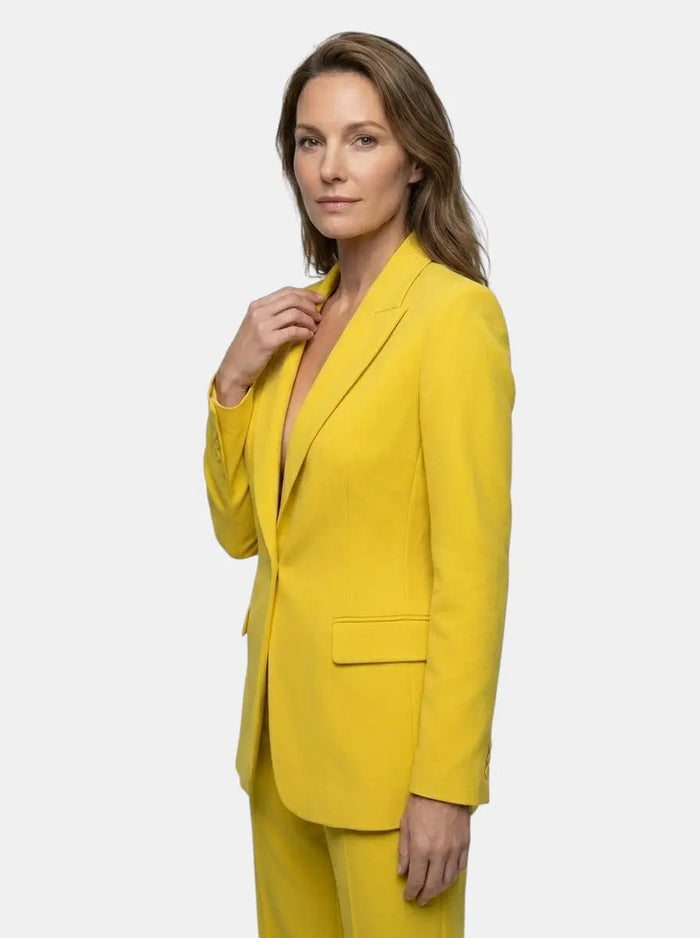 Elegant women's tailored blazer suit with a white longline blazer and wide-leg trousers, suitable for stylish office wear.