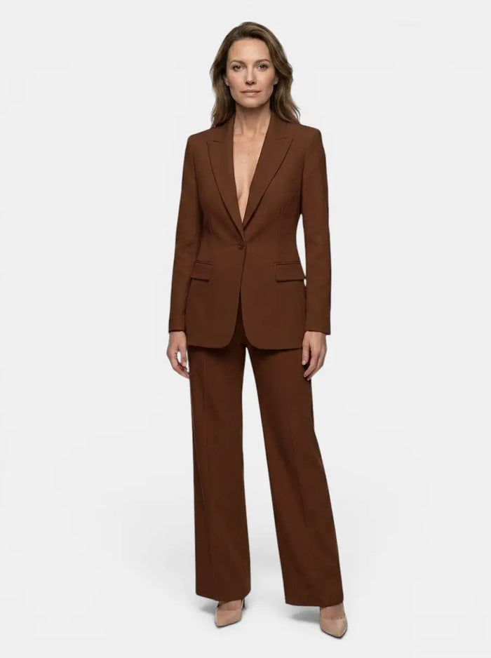 Women's elegant tailored blazer suit featuring a white longline blazer and wide-leg trousers, perfect for sophisticated office wear.