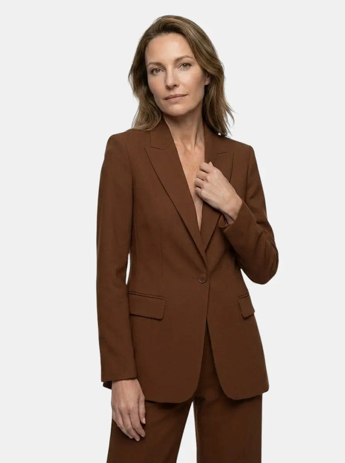 White longline tailored blazer and wide-leg trousers for women, part of an elegant suit set, styled for a sophisticated look.