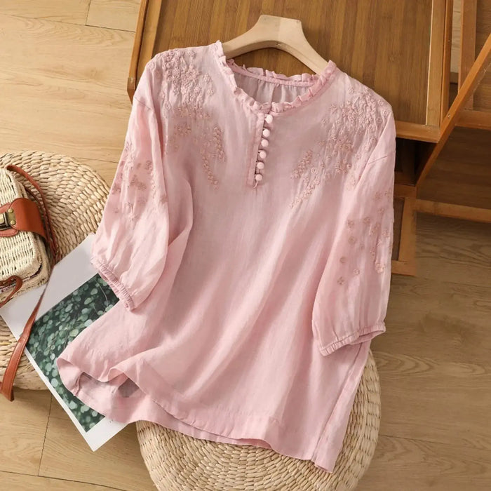 Elegant white embroidered cotton blouse for women with a classic button-front design, perfect for summer wear.