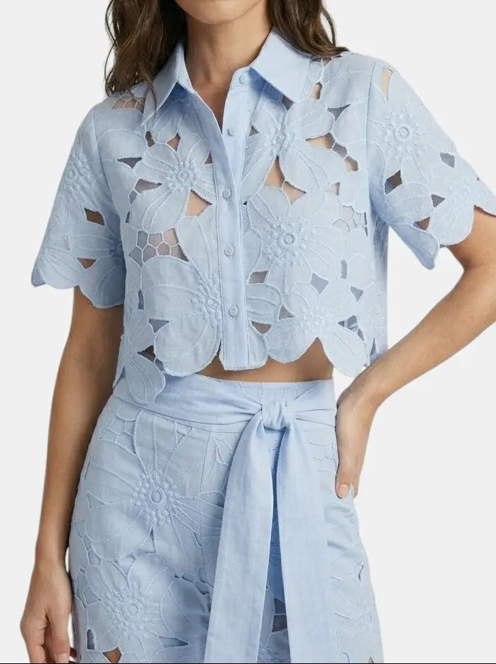Women's floral lace co-ord set featuring an elegant cropped top and wide-leg trousers, perfect for spring and summer occasions.
