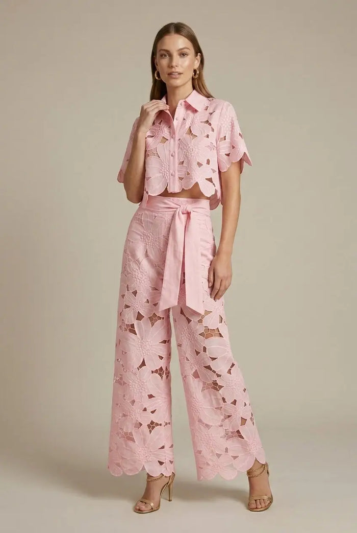 Women's floral lace two-piece set featuring an elegant cape overlay top and wide-leg trousers, stylish and sophisticated for women.