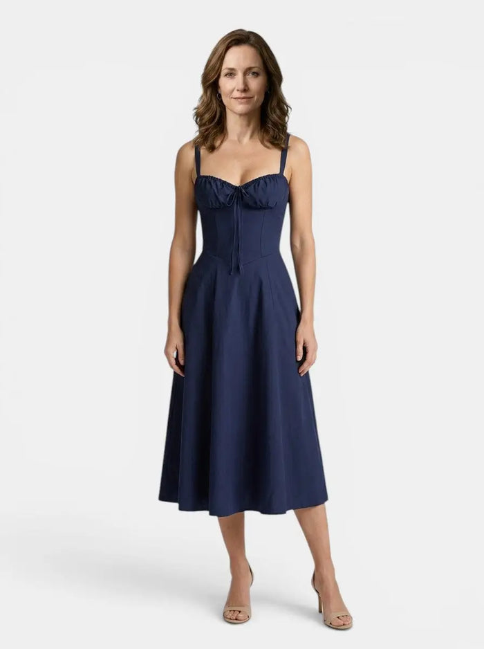 Women's floral midi dress with elegant corset styling and flowing skirt, perfect for summer occasions.