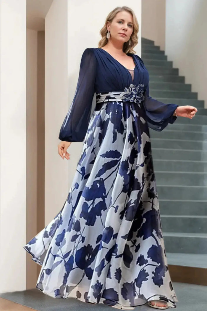 Women's floral print maxi dress with V-neck and balloon sleeves, elegant evening gown in vibrant floral fabric.