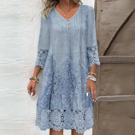 Women's floral print midi dress featuring embroidered accents and a structured summer design, perfect for elegant warm-weather wear.