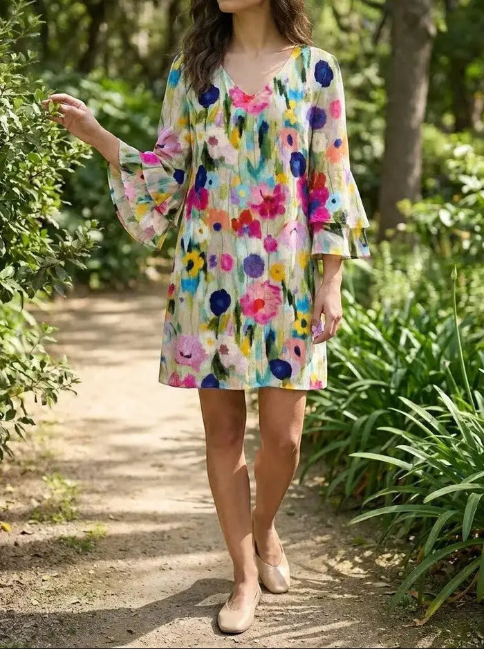 Women's floral print mini dress by LondonLaneStore featuring an elegant v-neck design, perfect for summer occasions.