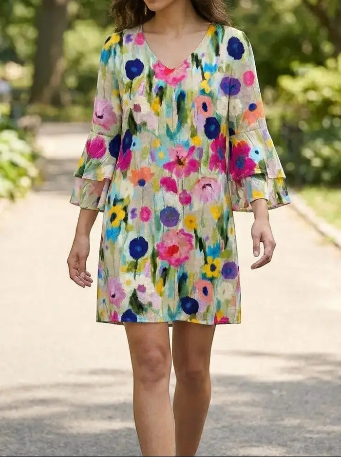 Women's floral print mini dress with elegant V-neck, perfect for summer and special occasions by LondonLaneStore.