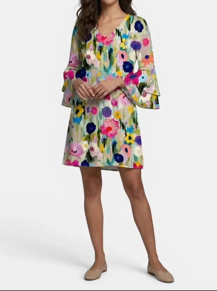 Women's floral print mini dress by LondonLaneStore featuring an elegant V-neck design, perfect for summer occasions.