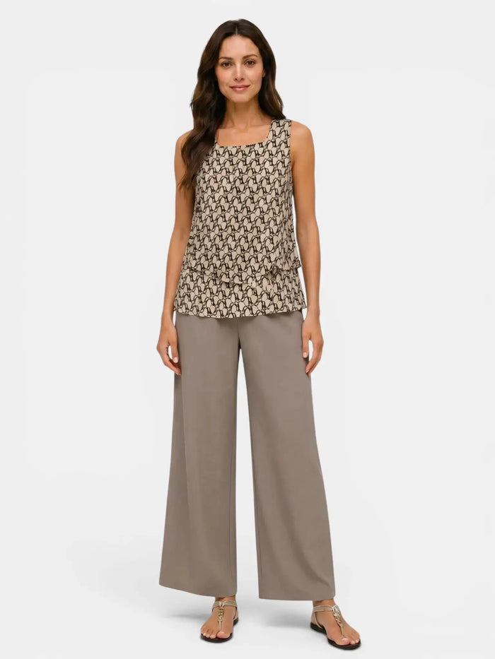Women's floral print layered sleeveless top and relaxed wide-leg trousers suit by LondonLaneStore, showing the stylish outfit on a model.