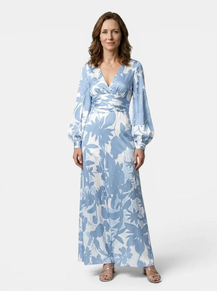 Women's flowing fabric maxi dress with a defined waist and long sleeves, perfect for summer, by LondonLaneStore.