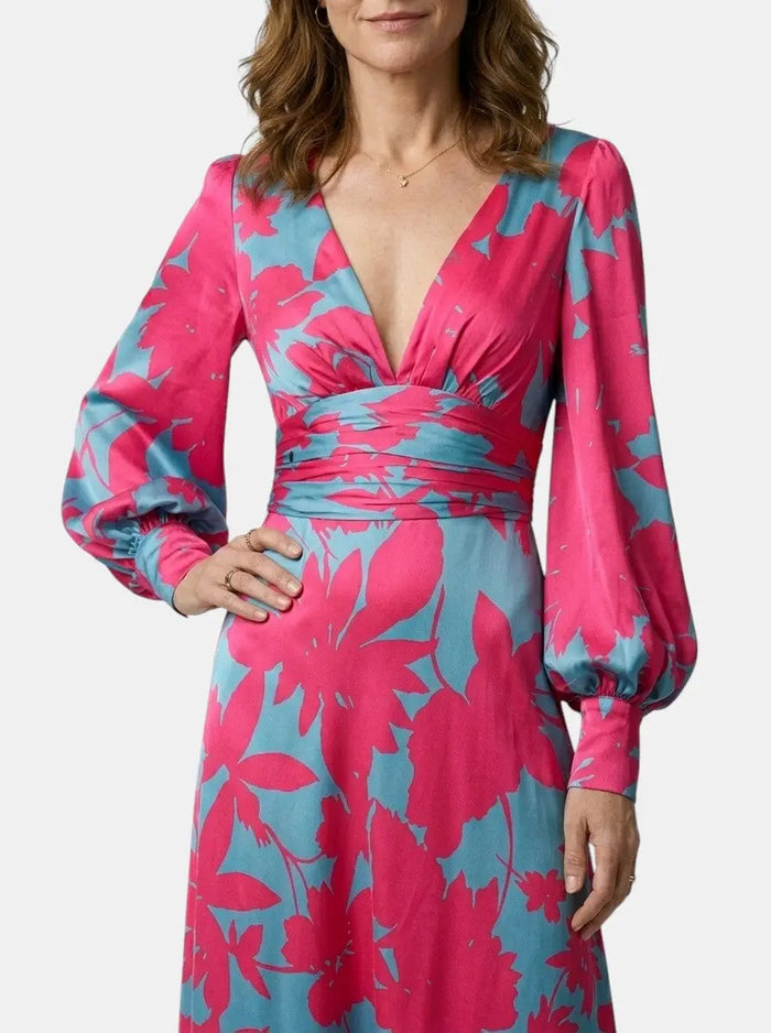 Women's flowing fabric maxi dress with a defined waist and long sleeves, perfect for summer, by LondonLaneStore.