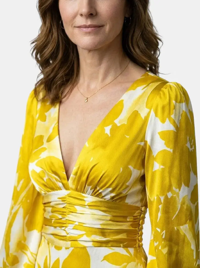 Women's flowing fabric maxi dress with defined waist and long sleeves, perfect for summer, by LondonLaneStore.