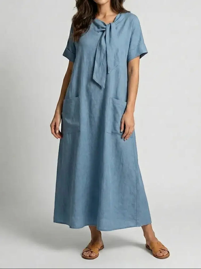 Women's flowy fabric summer dress with chic neck tie design and pockets, by LondonLaneStore, perfect for warm-weather style.