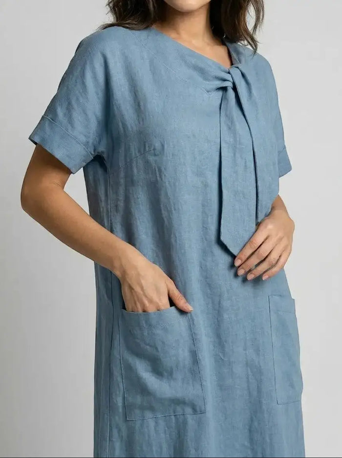 Women's flowy summer dress with chic neck tie, pockets, and elegant design by LondonLaneStore. Perfect for warm weather wear.