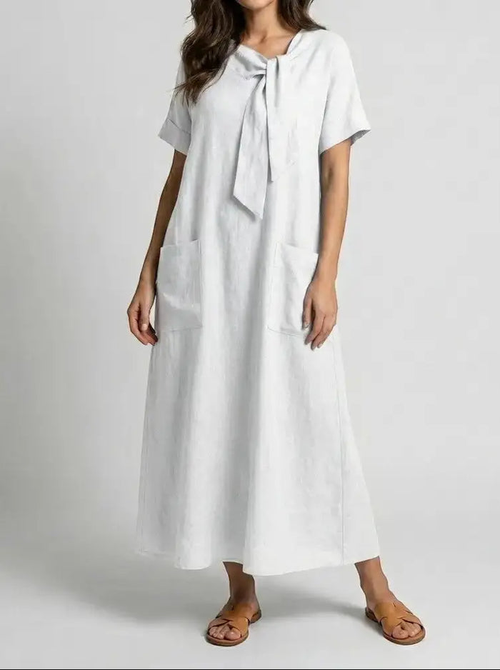 Women's flowy fabric summer dress by LondonLaneStore featuring an elegant chic neck tie design and convenient pockets.