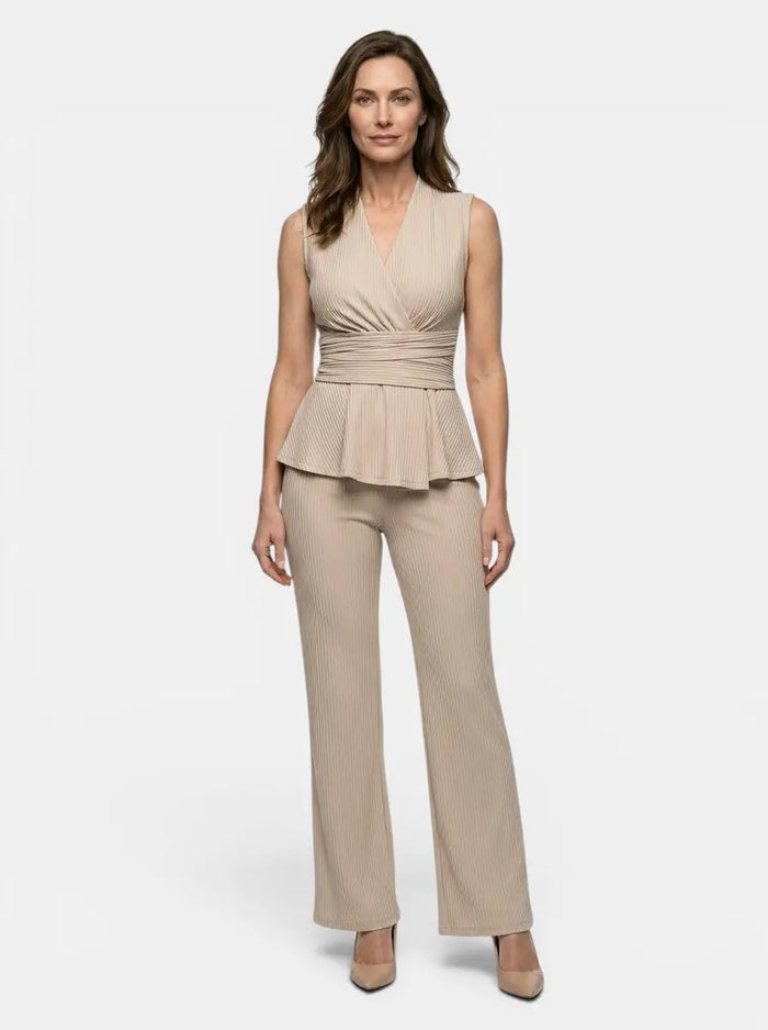 Elegant women's fluid drape wrap top and flared trousers set with tailored peplum style, perfect for sophisticated outfits.