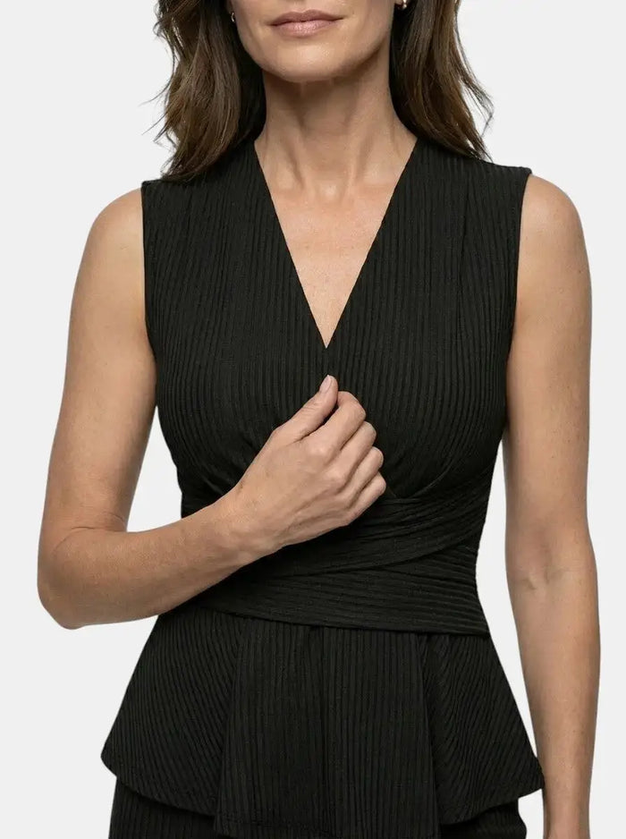 Elegant women's fluid drape wrap top and flared trousers set featuring a tailored peplum design, perfect for sophisticated wear.