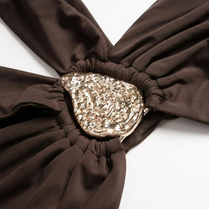 Women wearing a high-quality asymmetrical bikini set with metallic accents, stylish summer swimwear for women.