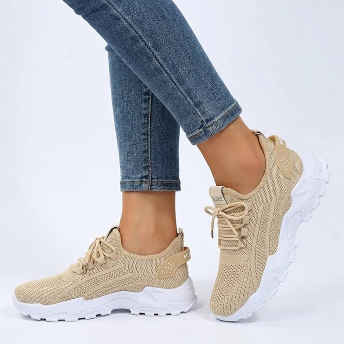 Women's knit fabric sneakers with a stylish low top design and chunky sole, perfect for casual walking.