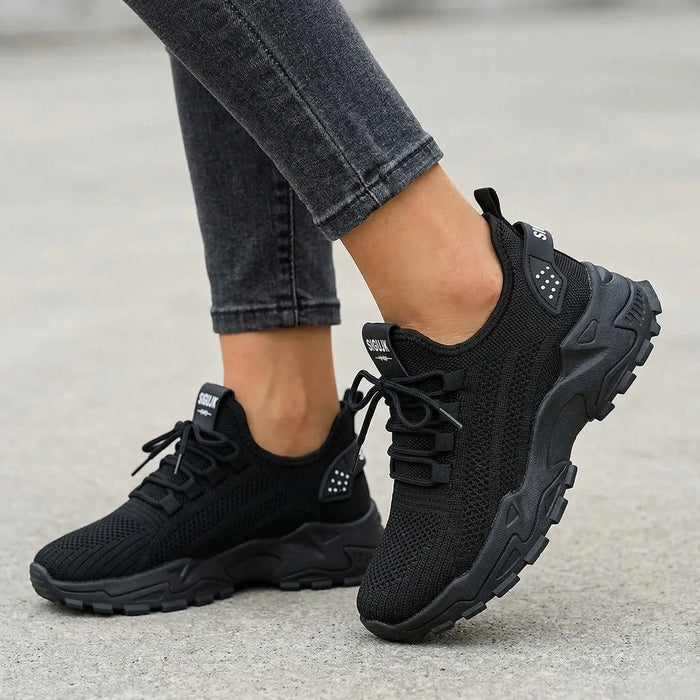 Women's knit fabric sneakers with stylish low top design and chunky sole, perfect for casual walking.