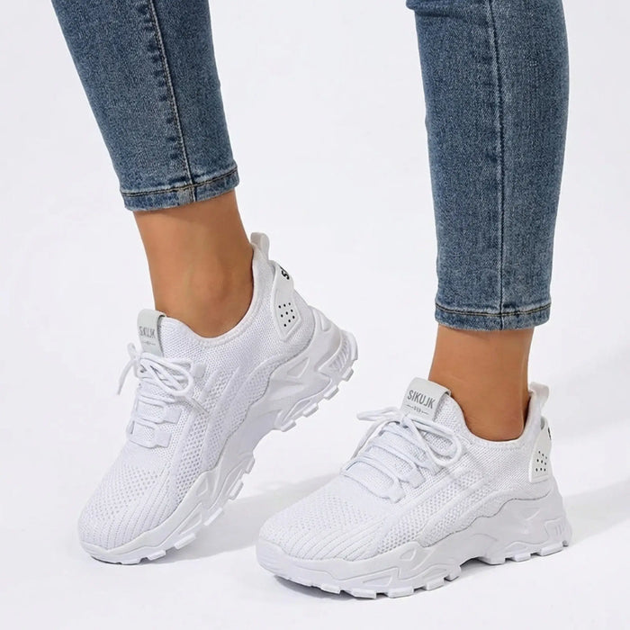 Women’s knit fabric sneakers with a stylish low top design and chunky sole, perfect for casual walking.