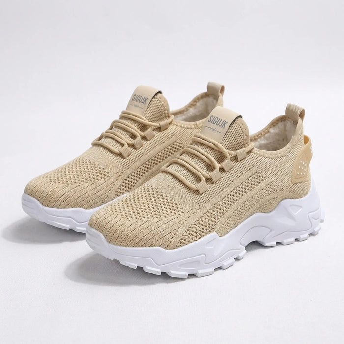 Women’s knit fabric sneakers with a stylish low-top design and chunky sole, ideal for comfortable walking.