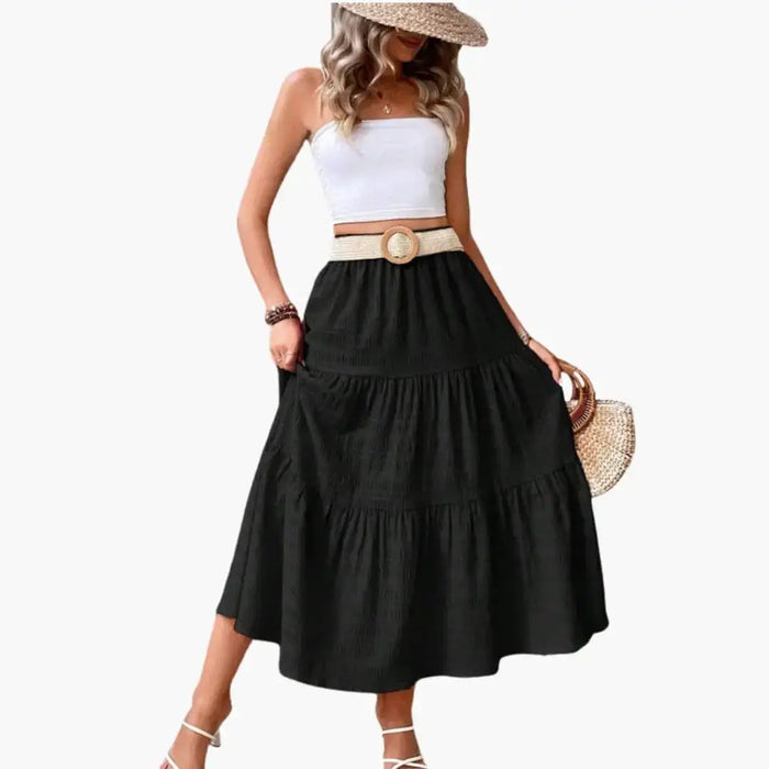 Women's layered woven maxi skirt with tiered ankle-length design, featuring elegant, flowing fabric and stylish tier details.