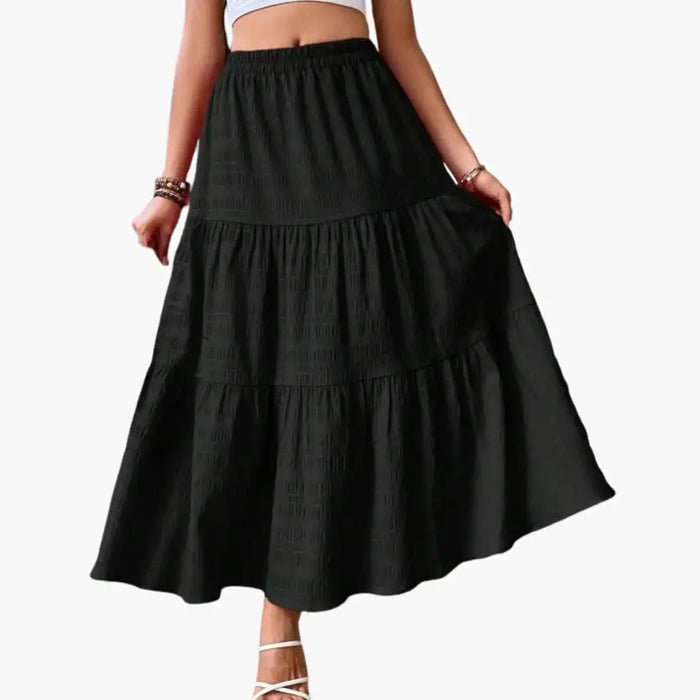 Women's layered woven maxi skirt with an elegant ankle-length tiered design, stylish and comfortable for everyday wear.
