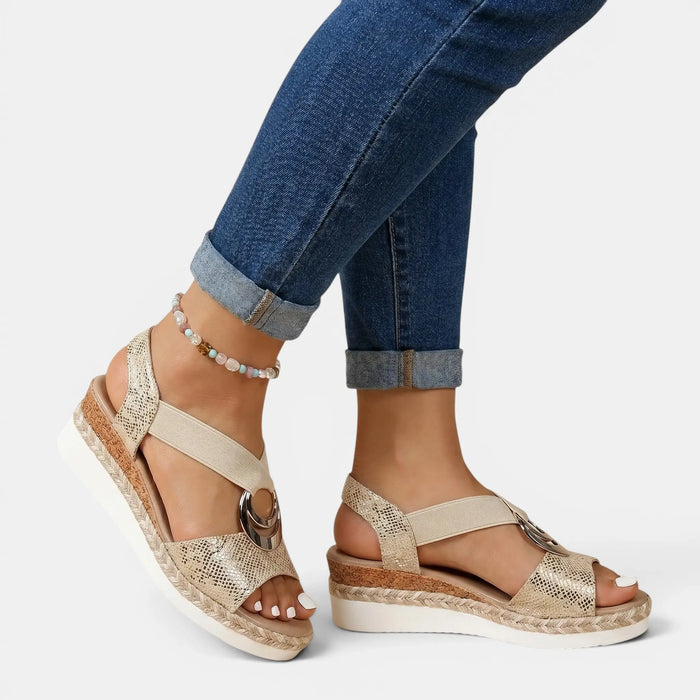 Women's leather platform sandals with open toe and adjustable ankle strap, showcasing a stylish and comfortable design.
