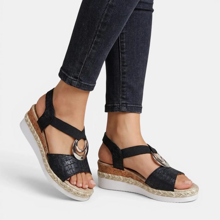 Women's leather platform sandals with open toe and adjustable ankle strap, featuring a stylish and comfortable design.