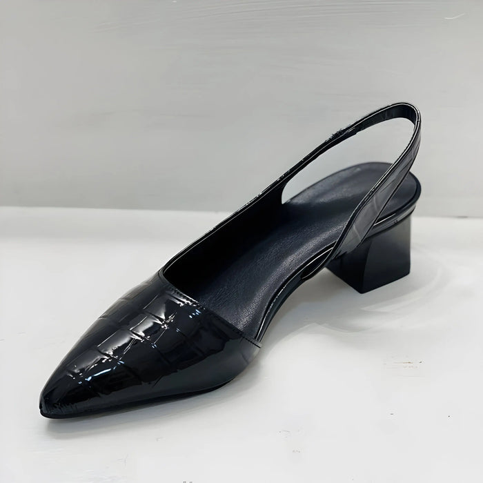 Women’s leather slingback heels with pointed toe and block heel, featuring a supportive design for stylish comfort.
