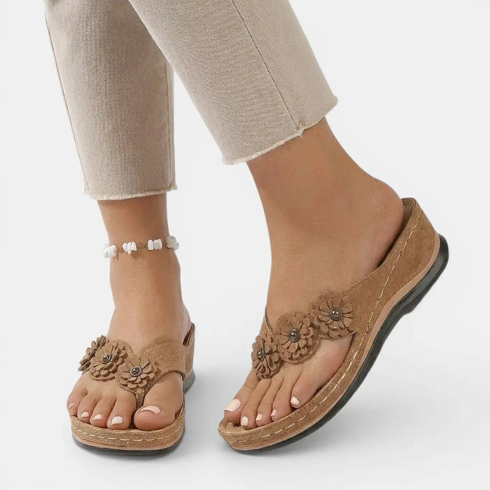 Women's leather slip-on orthopedic sandals with elegant design and comfortable footbed, ideal for everyday wear.