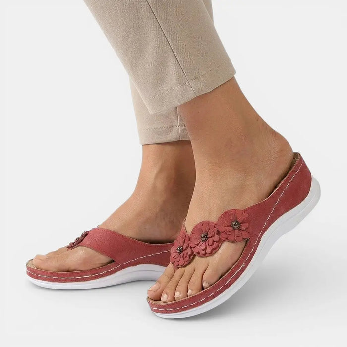 Women's leather slip-on orthopedic sandals with elegant design and comfortable sole, ideal for stylish and supportive footwear.