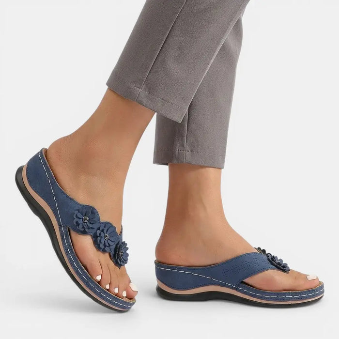 Women's leather slip-on orthopedic sandals with elegant design and comfortable footbed, perfect for everyday wear.