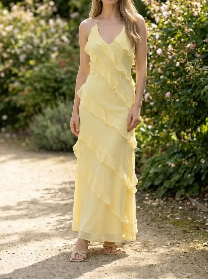 Women's light fabric maxi dress with halter neckline and tiered ruffles, perfect for summer events by LondonLaneStore.