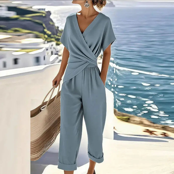 Women's lightweight fabric two-piece set with an elegant wrap-front top and relaxed trousers, stylish and comfortable for everyday wear.