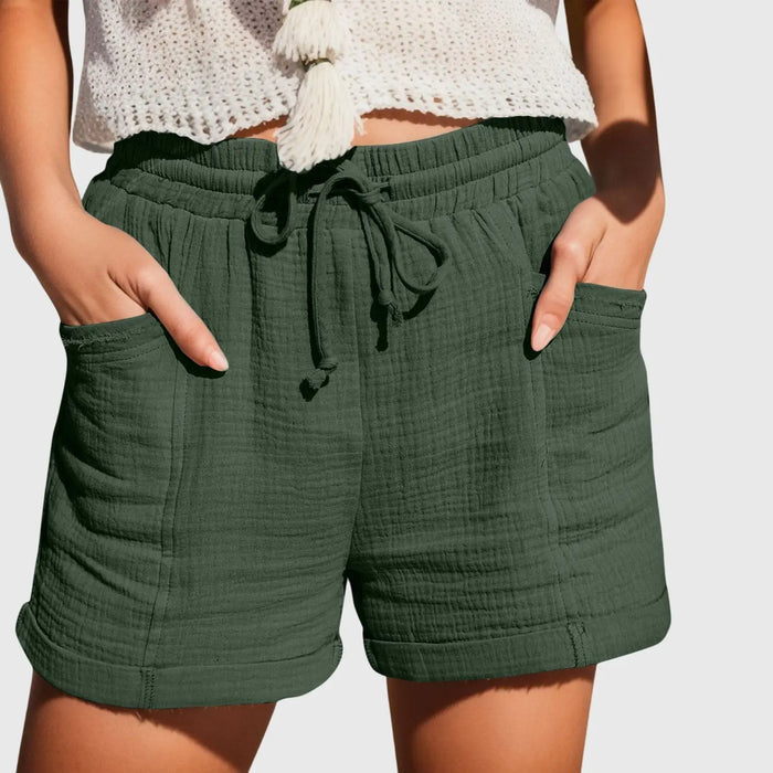 Women’s lightweight fabric wide-leg shorts in a breezy, comfortable summer style, shown in natural beige color.