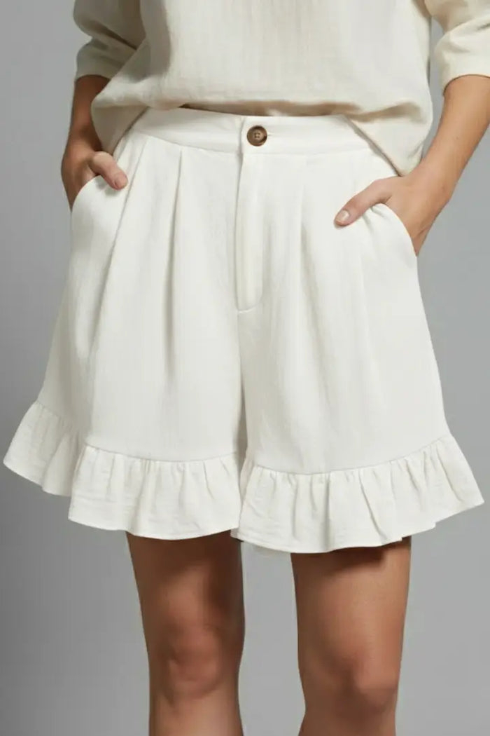 Women's lightweight ruffle hem shorts by LondonLaneStore, high-waist summer shorts with playful design, shown on a model.