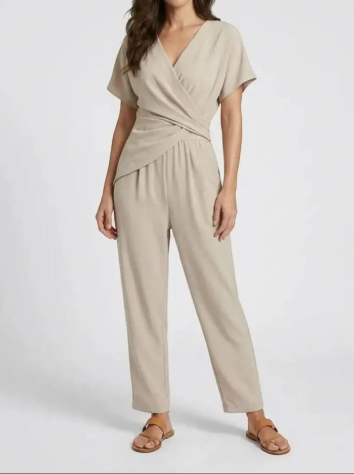 Women's lightweight two-piece set with an elegant wrap-front top and tailored trousers, stylish and comfortable for versatile wear.