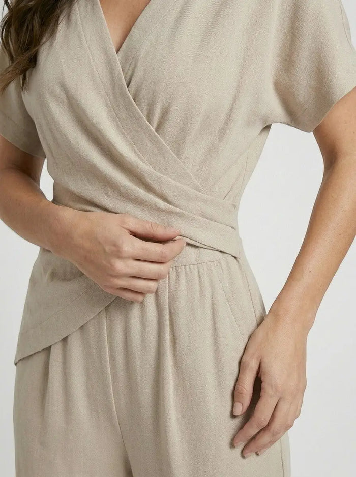 Women’s lightweight two-piece set with an elegant wrap-front top and tailored trousers, stylish outfit from LondonLaneStore.