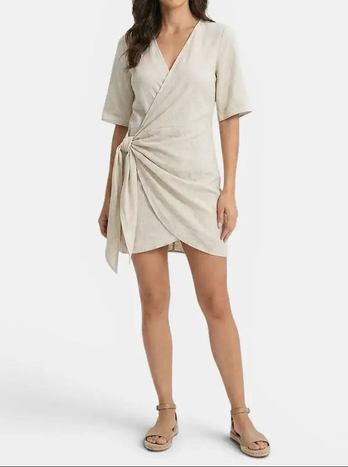 Women's linen blend wrap mini dress with elegant asymmetrical hem, perfect for summer, by LondonLaneStore.