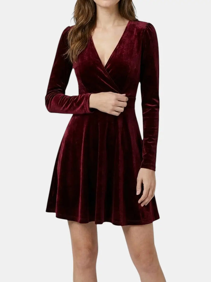 Elegant red velvet flare dress for women, featuring a flowing silhouette and formal evening gown style, perfect for special occasions.