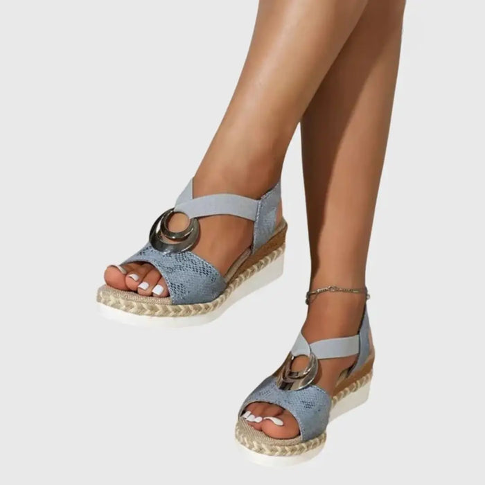 Women’s natural fabric wedge sandals with slingback straps and espadrille soles, designed for comfort and style.