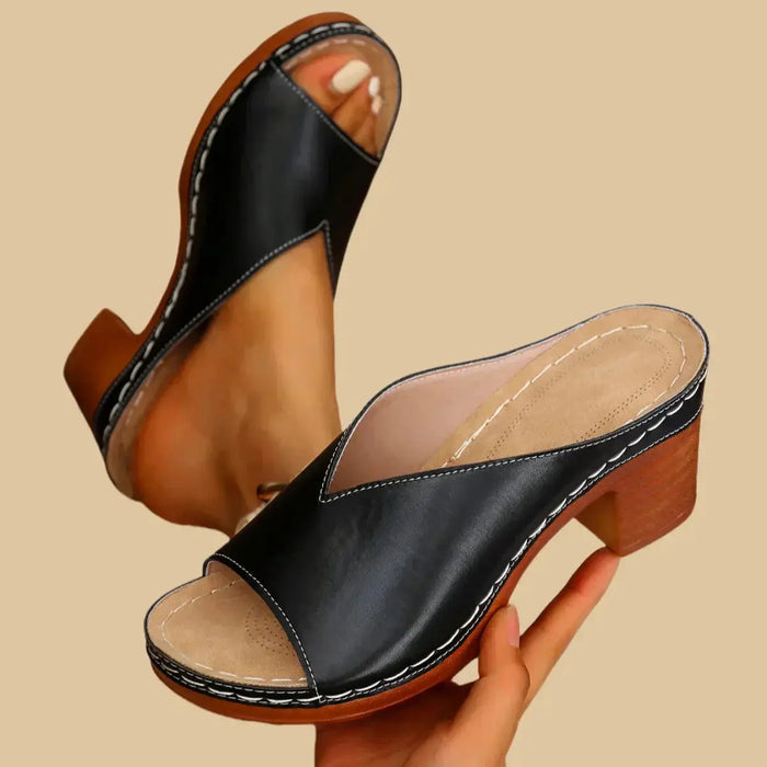 Women's orthopedic leather sandals with supportive thick heels, stylish and comfortable for everyday wear.