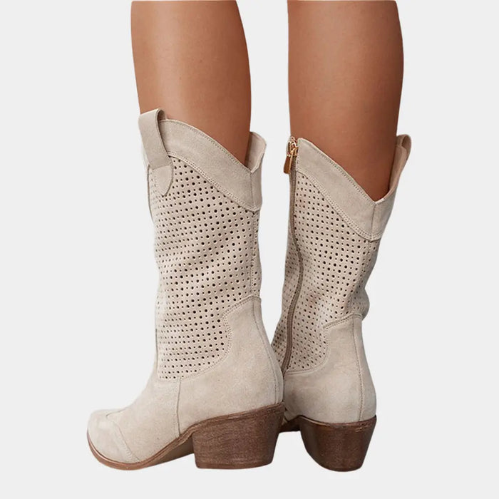 Women's perforated leather cowboy boots with stylish mid-calf design, featuring Western-inspired details and a classic Western boot silhouette.