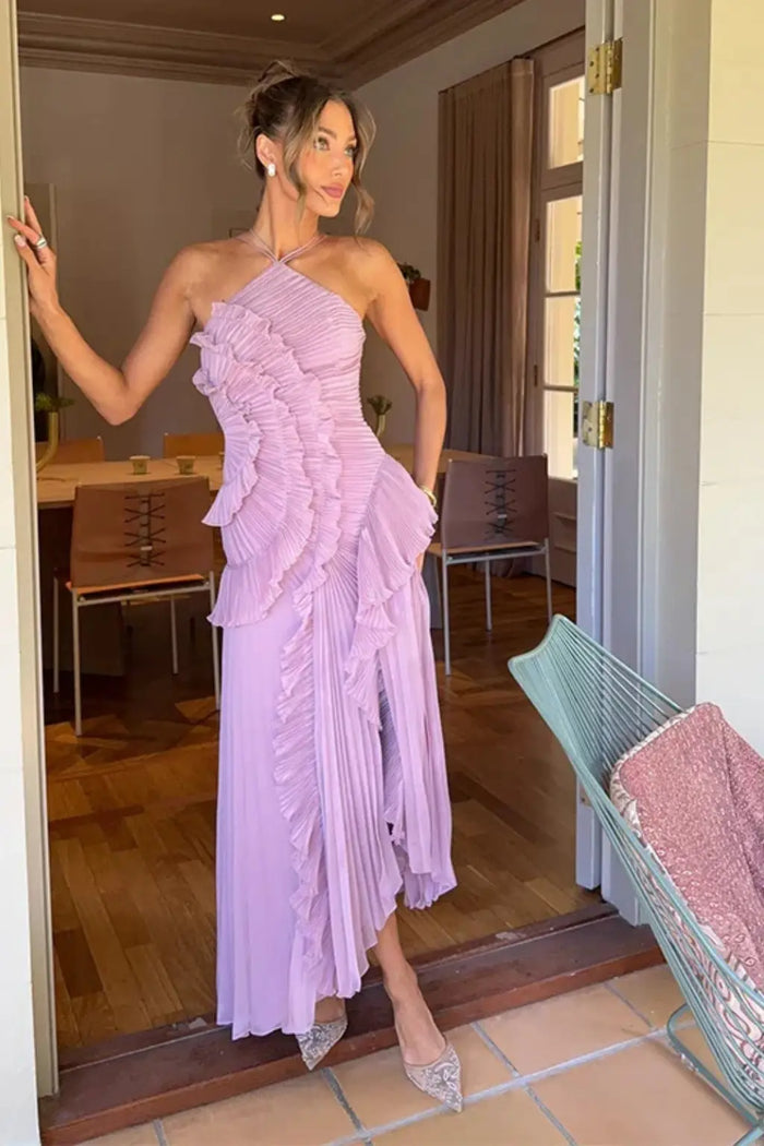 Women's pleated fabric maxi dress with layered ruffle halter neckline, stylish and flowy for elegant summer wear.