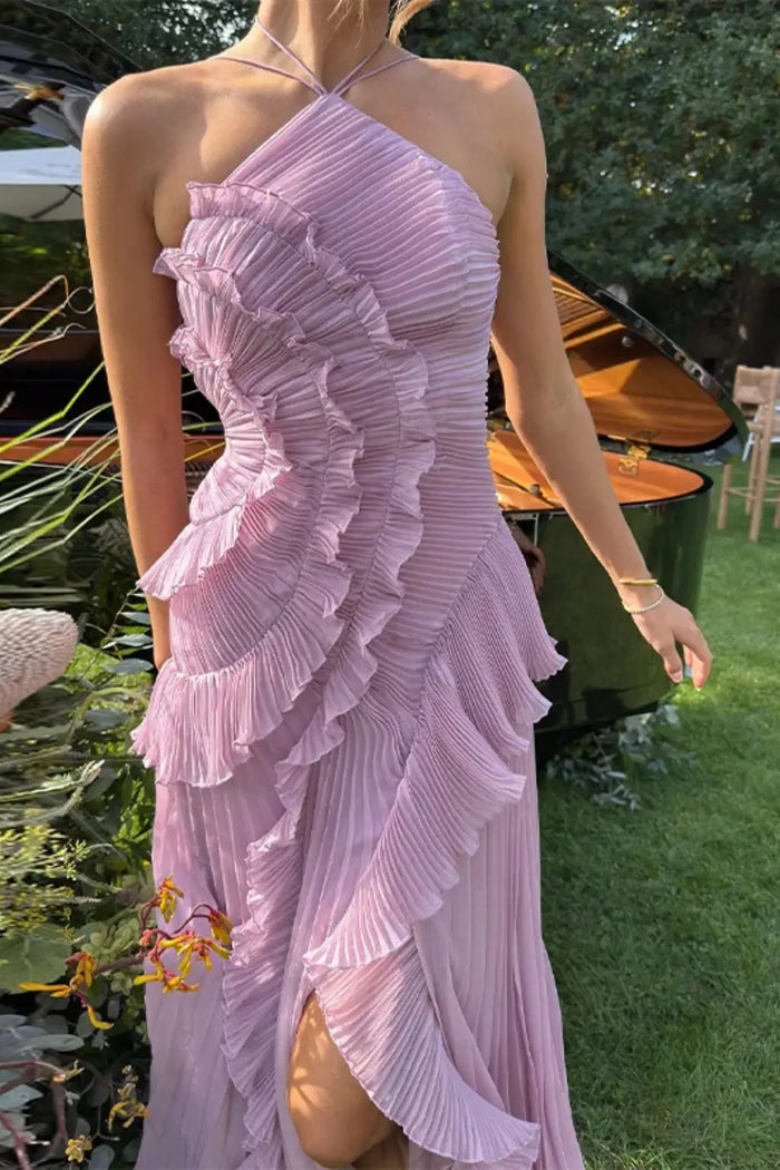 Women's pleated fabric maxi dress with layered ruffle halter neckline, stylish and flowy for elegant summer wear.
